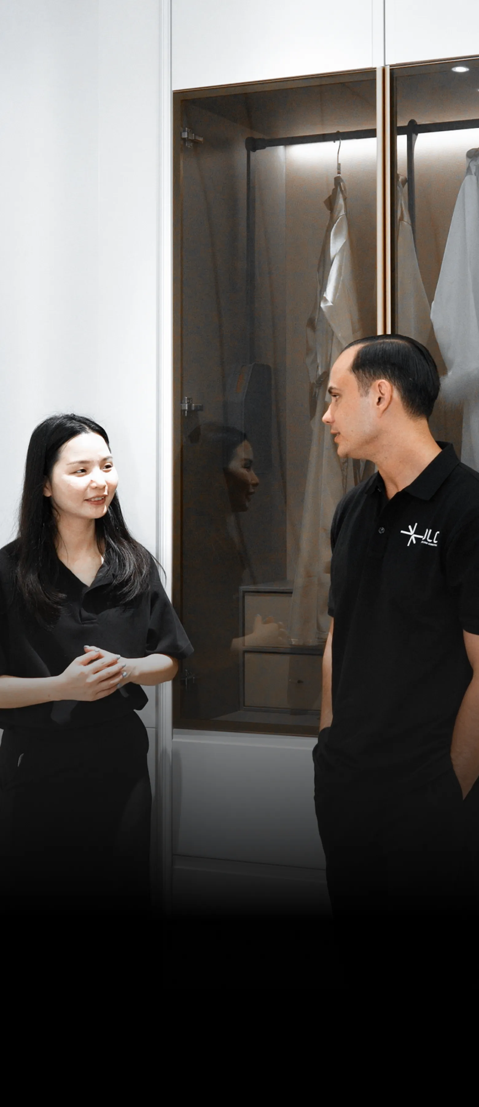 Two OLCO team members discussing a door sample with a supplier