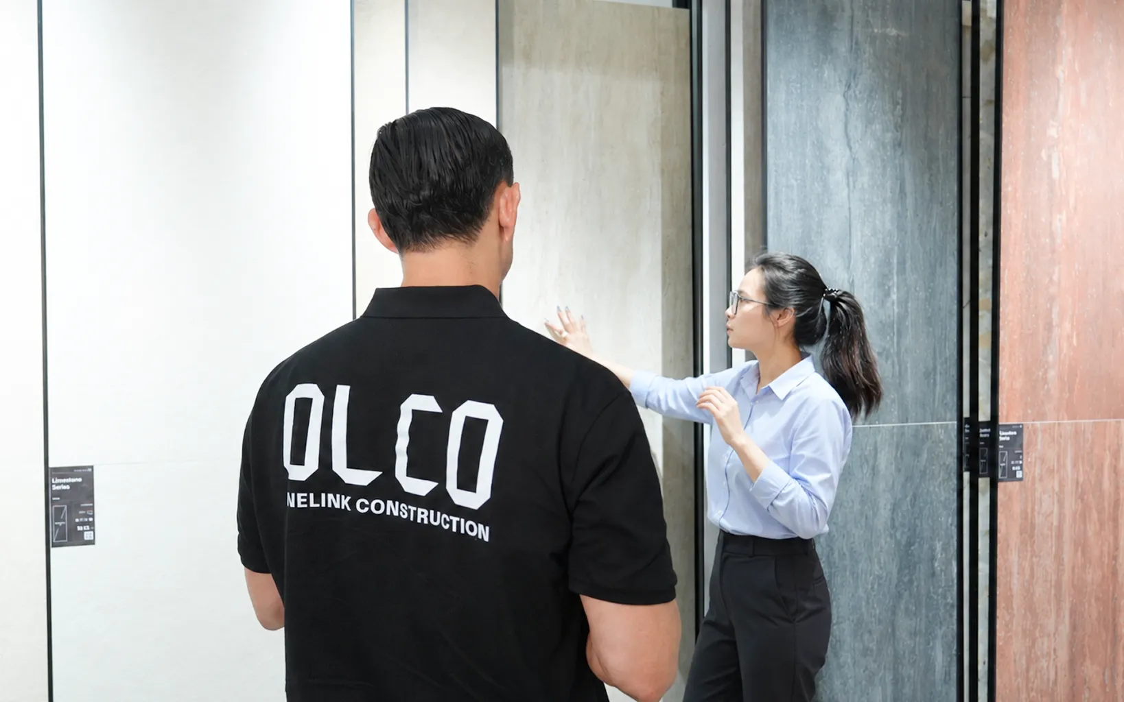 OLCO team reviewing door samples with a supplier in Vietnam