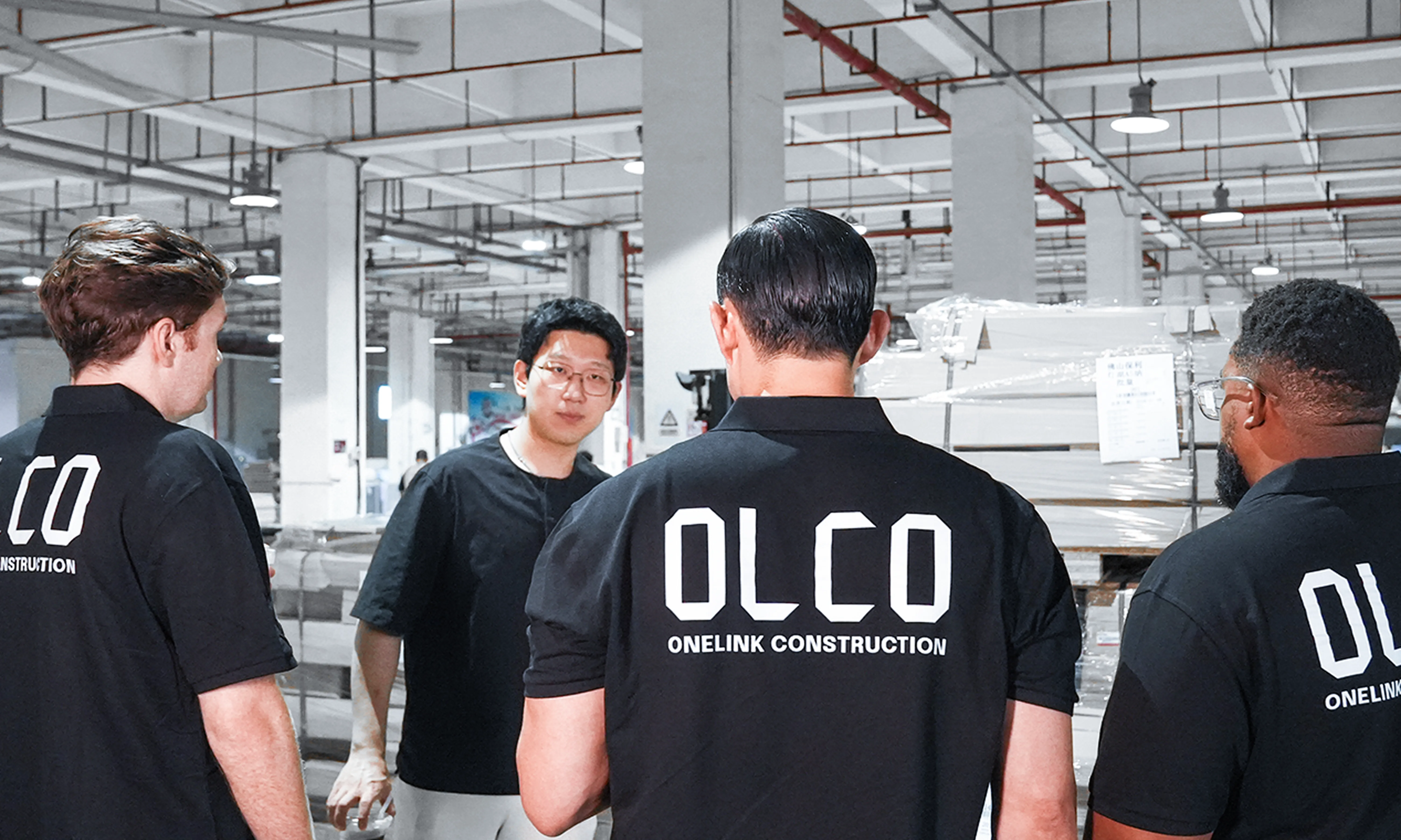 OLCO team members inspecting materials inside a partner factory