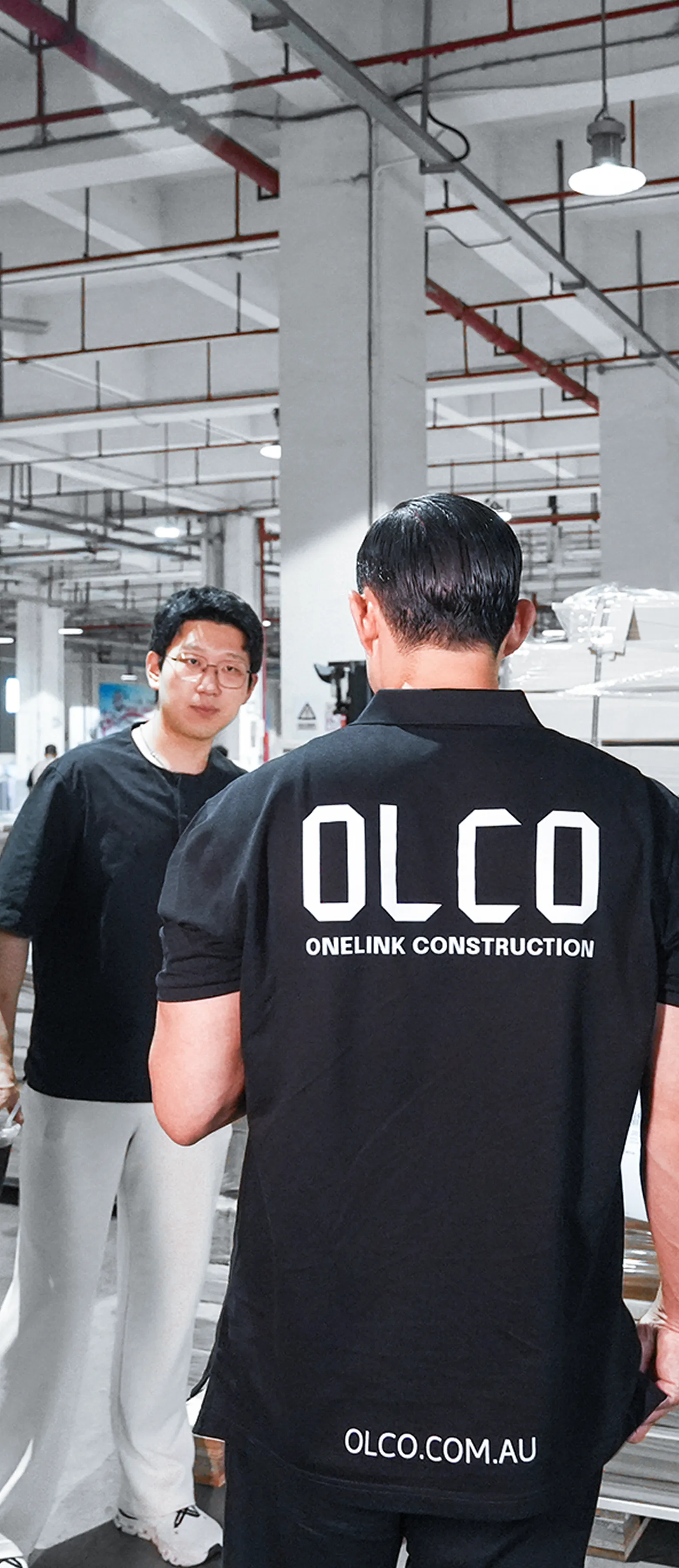 OLCO team members inspecting materials inside a partner factory